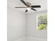 Cozy bedroom featuring a modern ceiling fan and ample natural light through the window, creating a comfortable retreat at 4434 Perch St, Tampa, FL 33617