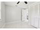 Bright bedroom featuring marble tile floors, ceiling fan, and an ample-sized closet at 4434 Perch St, Tampa, FL 33617