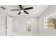 This is a well lit bedroom with a view into the bathroom at 4434 Perch St, Tampa, FL 33617