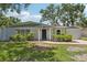 Charming single-story home with fresh exterior paint, manicured landscaping, and inviting entrance at 4434 Perch St, Tampa, FL 33617