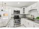 Bright kitchen features modern stainless steel appliances, granite countertops, and white cabinets at 4434 Perch St, Tampa, FL 33617
