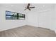 Bedroom with a ceiling fan and a view to the backyard at 4495 Clearwater Harbor S Dr, Largo, FL 33770