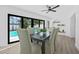Dining room with large sliders viewing the pool at 4495 Clearwater Harbor S Dr, Largo, FL 33770