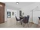 Dining room with modern decor, neutral color scheme, wooden floors, stylish decor and bright natural light at 4495 Clearwater Harbor S Dr, Largo, FL 33770