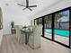 Dining room with a view of the pool and backyard at 4495 Clearwater Harbor S Dr, Largo, FL 33770