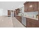 Stylish kitchen featuring modern cabinets, stainless steel appliances, quartz countertops, and ample storage space at 4495 Clearwater Harbor S Dr, Largo, FL 33770