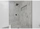 This tiled shower features a rainfall shower head and a built-in niche for toiletries at 4495 Clearwater Harbor S Dr, Largo, FL 33770