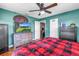 Comfortable bedroom featuring a dresser with mounted TV and access to the ensuite bathroom at 5001 37Th N Ave, St Petersburg, FL 33710