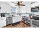 Bright kitchen featuring stainless steel appliances, ample cabinet space, and a modern design at 5001 37Th N Ave, St Petersburg, FL 33710