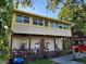 Charming two-story home with a covered front porch and mature landscaping at 516 7Th W Ave # 1, Palmetto, FL 34221
