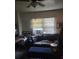 Inviting living room features a sofa, natural light and a window AC unit at 516 7Th W Ave # 1, Palmetto, FL 34221