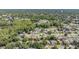 Serene aerial view of a lush neighborhood with tree-lined streets and well-maintained homes at 5423 Windbrush Dr, Tampa, FL 33625