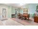 Bright dining room features a classic chandelier, window, and a neutral carpet at 5423 Windbrush Dr, Tampa, FL 33625