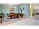 Formal dining room with neutral carpet, classic chandelier, and elegant wainscoting detail at 5423 Windbrush Dr, Tampa, FL 33625