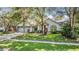 Charming home featuring a two-car garage, landscaped front yard, and beautiful curb appeal at 5423 Windbrush Dr, Tampa, FL 33625