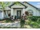 Charming home with a well-manicured front yard and inviting entrance at 5423 Windbrush Dr, Tampa, FL 33625