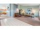 Open-concept living room with seamless flow from tiled entry to cozy carpet, great for entertaining at 5423 Windbrush Dr, Tampa, FL 33625