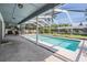 Inviting screened-in pool area with ample patio space for entertaining and enjoying the outdoors at 5423 Windbrush Dr, Tampa, FL 33625