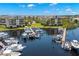 Overhead view of boat docks with multiple boats, highlighting waterfront living within this lovely condo community at 5567 Sea Forest Dr # 323, New Port Richey, FL 34652