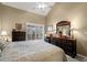 Spacious bedroom with neutral walls, large dresser, and a sliding door to the outside at 5567 Sea Forest Dr # 323, New Port Richey, FL 34652