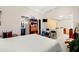 Large bedroom with white carpet, ensuite bath, and bonus area for office or workout equipment at 5567 Sea Forest Dr # 323, New Port Richey, FL 34652