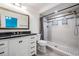 Bathroom features a modern vanity with dark countertop and a walk-in shower with decorative tile accents at 6 Harbor Cove St, Safety Harbor, FL 34695