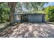 Charming single-story home featuring a brick driveway, well-kept landscaping, and attached two-car garage at 6 Harbor Cove St, Safety Harbor, FL 34695