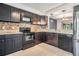 Features dark brown cabinets with granite countertops and stainless steel appliances at 6 Harbor Cove St, Safety Harbor, FL 34695