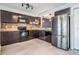 This is a spacious kitchen with stainless steel appliances, granite countertops, and decorative mosaic tile backsplash at 6 Harbor Cove St, Safety Harbor, FL 34695