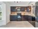 Features dark brown cabinets with granite countertops and stainless steel appliances at 6 Harbor Cove St, Safety Harbor, FL 34695