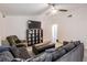 The living room features multiple couches, a ceiling fan and natural light at 6 Harbor Cove St, Safety Harbor, FL 34695