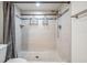 Bright tiled shower featuring a shower curtain and mounted shelving at 6 Harbor Cove St, Safety Harbor, FL 34695