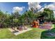 Spacious backyard featuring a play area and workout equipment, ideal for recreation and fitness at 604 Knollwood Dr, Largo, FL 33770