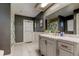 Bathroom featuring a vanity with a white countertop, white cabinets, and tile floors at 604 Knollwood Dr, Largo, FL 33770