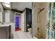 Bathroom featuring a vanity with a white countertop, white cabinets, tile floors, and shower with a shower curtain at 604 Knollwood Dr, Largo, FL 33770