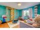 A play room with climbing equipment, a small trampoline, and lots of toys at 604 Knollwood Dr, Largo, FL 33770