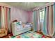 Bedroom with colourful decor and large windows, a space of dreams and imagination at 604 Knollwood Dr, Largo, FL 33770