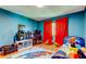bedroom featuring a bed, a window, gaming consoles, and colourful rug at 604 Knollwood Dr, Largo, FL 33770
