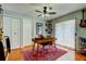 A well-appointed home office with a desk, shelving, and warm lighting at 604 Knollwood Dr, Largo, FL 33770