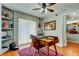 Bright home office with shelving, a desk, and a view to the home's interior at 604 Knollwood Dr, Largo, FL 33770