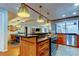 Gourmet kitchen with a large island, stainless steel appliances, and modern countertops at 604 Knollwood Dr, Largo, FL 33770