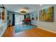 Bright music room with an upright piano, musical instruments and light blue accent wall at 604 Knollwood Dr, Largo, FL 33770