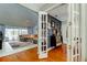 Open-concept living area view through French doors with seating and tile flooring at 604 Knollwood Dr, Largo, FL 33770