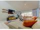 Open living room featuring a sectional sofa and sliding glass doors to the lanai at 604 Knollwood Dr, Largo, FL 33770