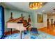 Elegant music room showcasing an upright piano, hardwood floors, and stylish decor at 604 Knollwood Dr, Largo, FL 33770