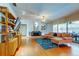 Inviting living room featuring hardwood floors, contemporary furniture, and a cozy fireplace at 604 Knollwood Dr, Largo, FL 33770