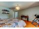 Bright main bedroom with hardwood floors, modern decor, and convenient access to the ensuite bathroom at 604 Knollwood Dr, Largo, FL 33770