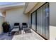 A cozy brick-paved patio with comfortable chaise lounges and lush greenery, perfect for relaxation and outdoor living at 604 Knollwood Dr, Largo, FL 33770