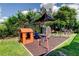 Spacious backyard play area with multiple activities for and adults at 604 Knollwood Dr, Largo, FL 33770