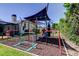 Backyard playground with shade structure, offering fun for all ages at 604 Knollwood Dr, Largo, FL 33770